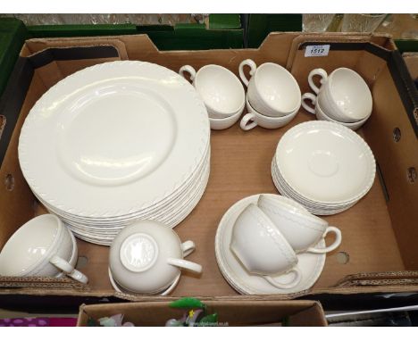 A quantity of white china including thirteen dinner plates, fourteen saucers and twelve teacups.