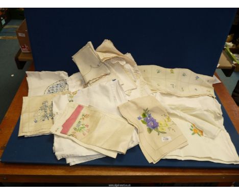 Various items of vintage table linen including hand embroidered items.