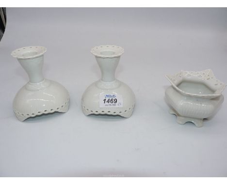 A white ground Royal Copenhagen dressing table set of matching candlesticks and trinket dish, with pierced detail.