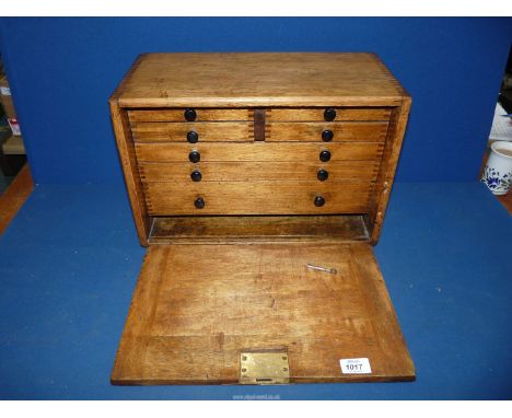 A vintage Oak workman's chest having internal drawers, with key, 17" x 8 1/2" x 11".