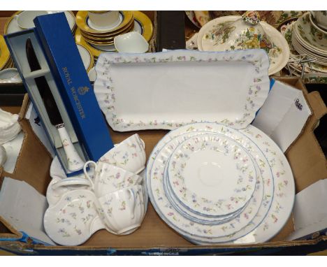 A quantity of Royal Worcester 'Forget me Not' china including cups, saucers, tea plates, cake and sandwich plates, etc.