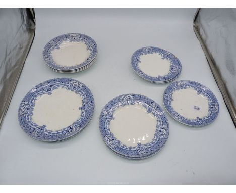 A quantity of blue and white plates including dinner, breakfast and side plates, some chips and cracks.