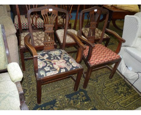 A pair of Georgian design Mahogany open-armed Elbow Chairs standing on square legs, the back splats having carved and fretwor