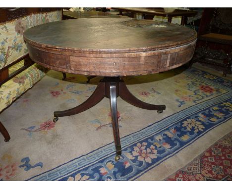 A most uncommon 19th century Mahogany rent table of drum form having four drawer recesses (sadly only three drawers present) 