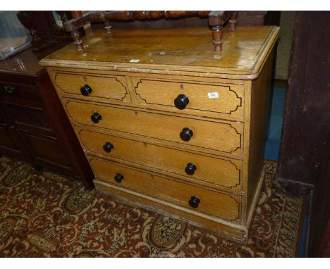 A Pine carcassed Chest of three long and two short Drawers with ebonised knobs and having a combed stain finish resembling li