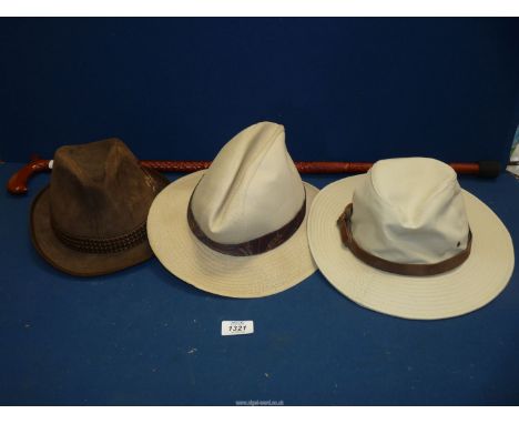 A carved wooden walking stick and three gents trilby/trilby style hats;  Dunn &amp; Co., size 59 (7 1/4), Hush Puppies, size 