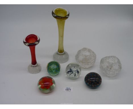 Two studio glass bud vases, pair of night light holders and four paperweights including green and blue swirl, black spider st