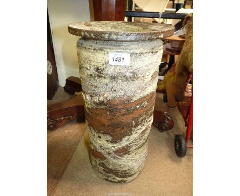 A Brutalist style studio pottery Stick Stand in brown and cream, signed to base Peter Larter '75, 17 3/4'' tall.