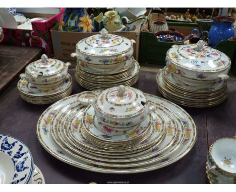 A Regal Ware dinner service with floral and chevron style decoration, dinner, breakfast, side plates and graduated platters, 