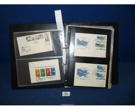 A black Folder, an eclectic mix of worldwide circa 1950's First Day Covers, First day of issue postal material includes K.U.T