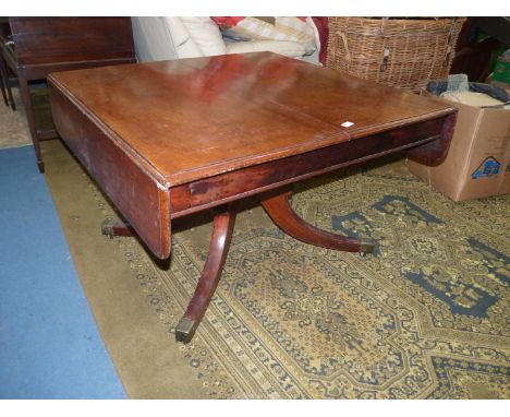 A 19th century Mahogany rectangular Dining/Centre Table having barrow drop leaves and riased on a most substantial turned pil