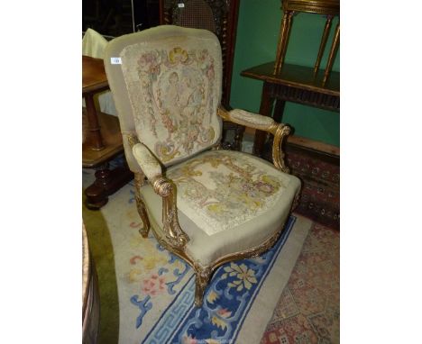 A fine old giltwood framed, broad seated fauteuille/open armed armchair the arms with very good scroll detail, the legs with 