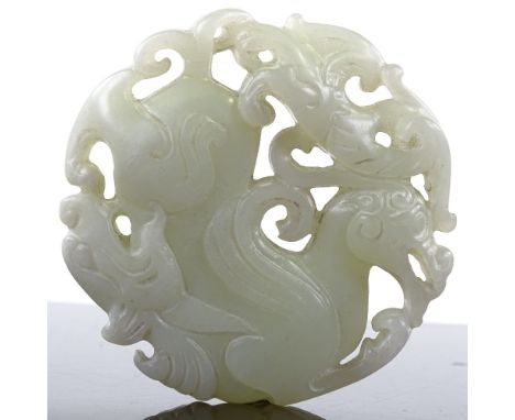 A Chinese relief carved and pierced jade pendant, 5cm across 