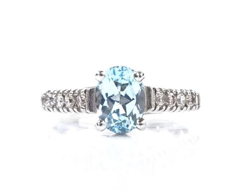 A 14ct white gold aquamarine dress ring, with diamond set shoulders, setting height 8mm, size M, 3.8g 