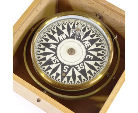 An Edwardian brass-mounted ship's gimballed compass, dial marked 1910 Aspley Senior School Hemel Hempstead, dial diameter 16c