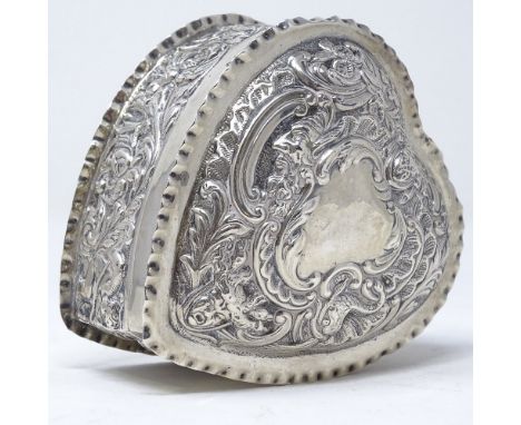 A Victorian silver heart-shaped trinket box, with relief embossed floral and foliate decoration, by William Comyns &amp; Sons