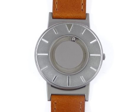 THE BRADLEY TIMEPIECE - a titanium Eone quartz wristwatch, silvered dial with baton hour markers and 2 magnetised ball bearin
