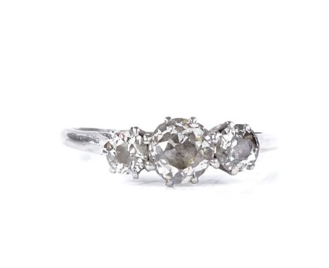 An unmarked white metal 3-stone diamond ring, total diamond content approx 1ct, setting height 6.1mm, size P, 2.3g 