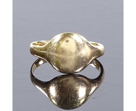 An 18ct gold signet ring, with plain central panel, setting height 10mm, size K, 3.1g 