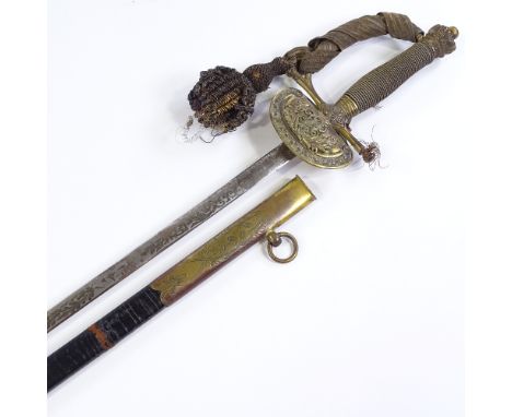 A Victorian dress sword with etched blade, signed Scott Son &amp; Claxton of New Bond Street London, gilt-brass and wire-boun