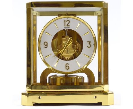 A Jaeger Lecoultre Atmos clock, gilt-brass case with glass panels, recently serviced, with original box and papers, and in wo