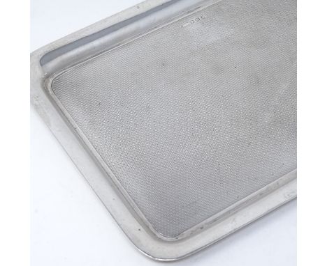 A George V rectangular silver tray, with engine turned decoration, indistinct maker's marks, hallmarks Birmingham 1926, lengt
