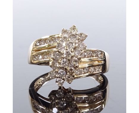 A 14ct gold diamond cluster flowerhead ring, with channel set diamond shoulders, total diamond content approx 0.5ct, setting 