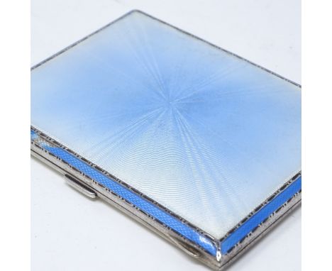 A rectangular silver and blue enamel cigarette case, with engine turned decoration and gilt interior, by Adie Brothers Ltd, h