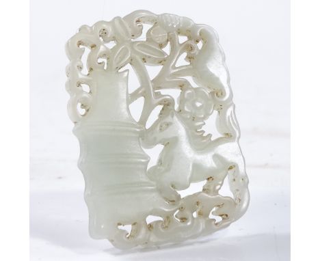 A Chinese carved and pierced jade pendant, length 5cm 