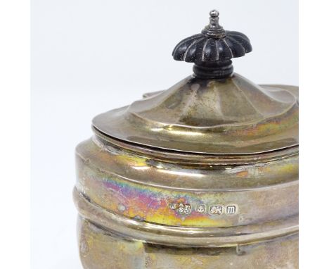 A George V squat silver tea caddy, with turned ebony handle and gilt interior, probably by Junior Army &amp; Navy Stores, hal