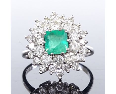 An 18ct white gold emerald and diamond cluster cocktail ring, emerald approx 1.2ct, total diamond content approx 1.5ct, setti