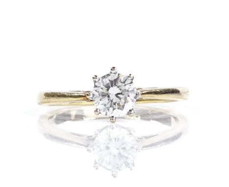An 18ct gold 0.66ct solitaire diamond ring, setting height 7mm, size O, 3.2g 