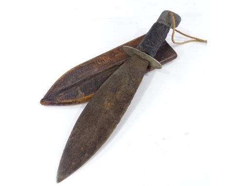 A Second War Period British Commando machete with broad blade and original rubber handle, in leather scabbard, length 40cm 