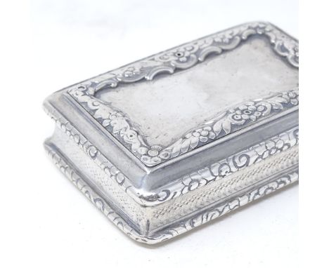 A William IV rectangular silver snuffbox, with relief embossed floral decoration and engine turned border, by Nathaniel Mills