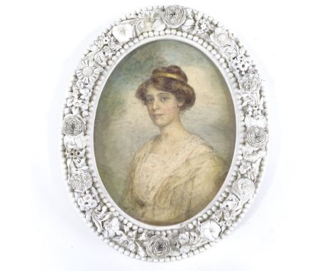 Watercolour circa 1900, portrait of a lady in ornate floral encrusted white glaze porcelain frame, overall height 32cm 