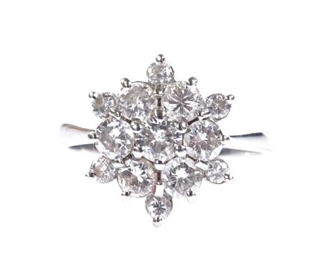 An 18ct white gold diamond cluster snowflake ring, total diamond content approx 1.2ct, setting height 13.5mm, size L, 3.7g 