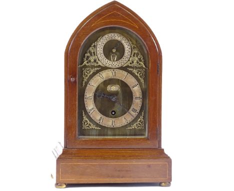 An Edwardian mahogany-cased lancet-top mantel clock, with brass and silvered dial and 8-day movement, height 38cm 