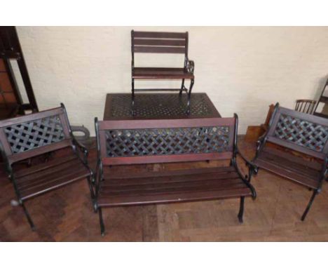 Cast metal garden furniture with lattice work back complete with table; bench; two chairs and similar chair. Condition report