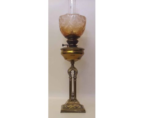 Victorian oil lamp, amber glass shade with cast Gothic design, four column base. Condition report: see terms and conditions
