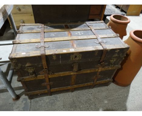 A Wooden And Leather Banded Travelling Trunk