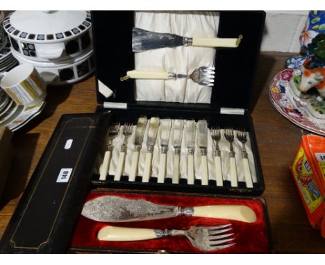 A Cased Pair Of Victorian Fish Servers Together With A Cased Fish Knife And Fork Set