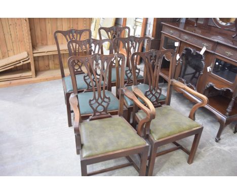 A set of six Chippendale style mahogany dining chairs, early 20th CenturyEach with an interlaced splat back and a drop in sea