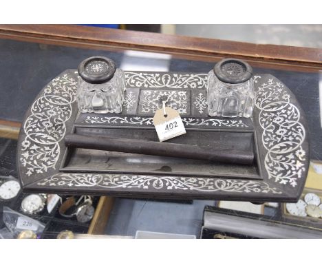 A late 19th/early 20th Century hardwood and mother of pearl desk tidyThe tray extensively inlaid with a geometric trailing an