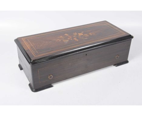 A late 19th Century Swiss Rosewood cased music box The inlaid marquetry hinged case, with floral sprays, hinged cover reveali