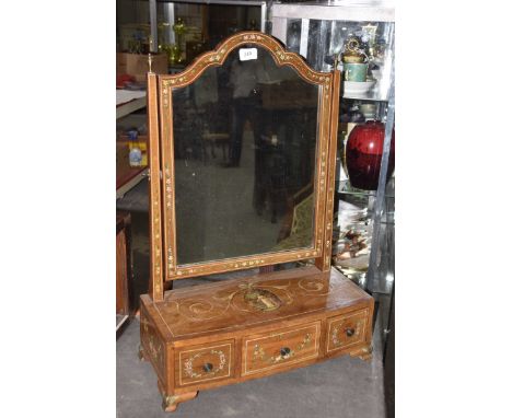 An early 19th Century swing dressing mirrorThe bowfront base raised ogee bracket feet and set with one long drawer and two sh