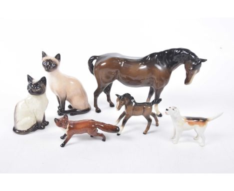 A collection of six Beswick and Royal Doulton figuresTo include a Royal Doulton Siamese Cat HN2655, a Beswick siamese cat sta