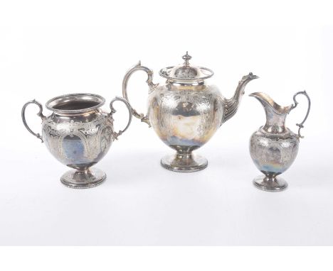 A late Victorian three-piece EPNS tea service To include a pedestal teapot, twin handled sugar bowl and milk jug, all heavily