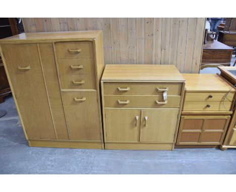 Three items of Mid 20th century furniture To include a light oak gents wardrobe with a single cupboard door opposed by three 