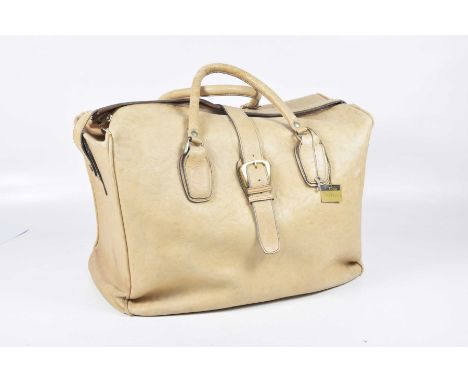 A vintage 1970's Toko cream leather travel bag/holdall
With twin folded leather handles, zip top and buckled sides, revealing