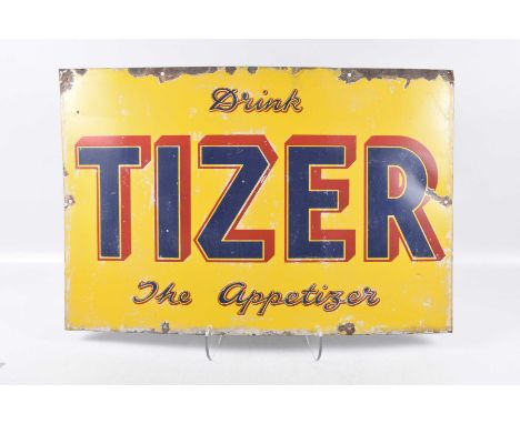 A vintage enamel "Tizer" signThe yellow enamel sign with text "Drink Tizer, the Apertizer", 51x76cm.